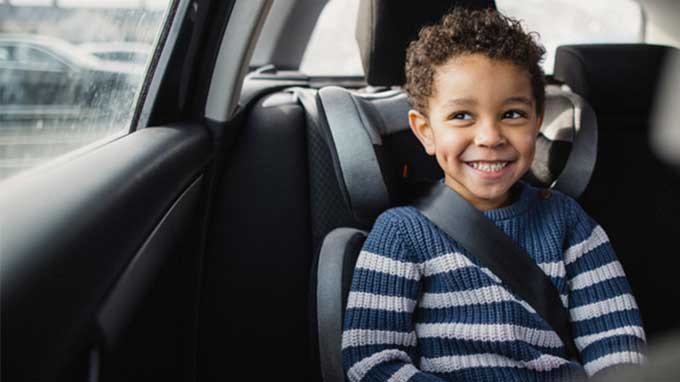 child in booster seat