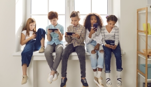 Kids looking at cellphones