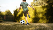 child playing soccer