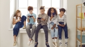 Kids looking at cellphones