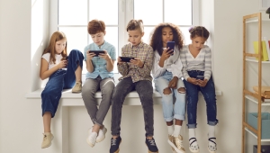 Kids looking at cellphones