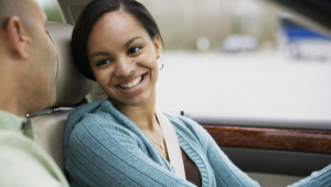 Teen girl driver smiling at parent