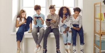 Kids looking at cellphones